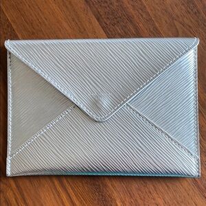 Louis Vuitton - authentic and rare Metallic Silver Clutch